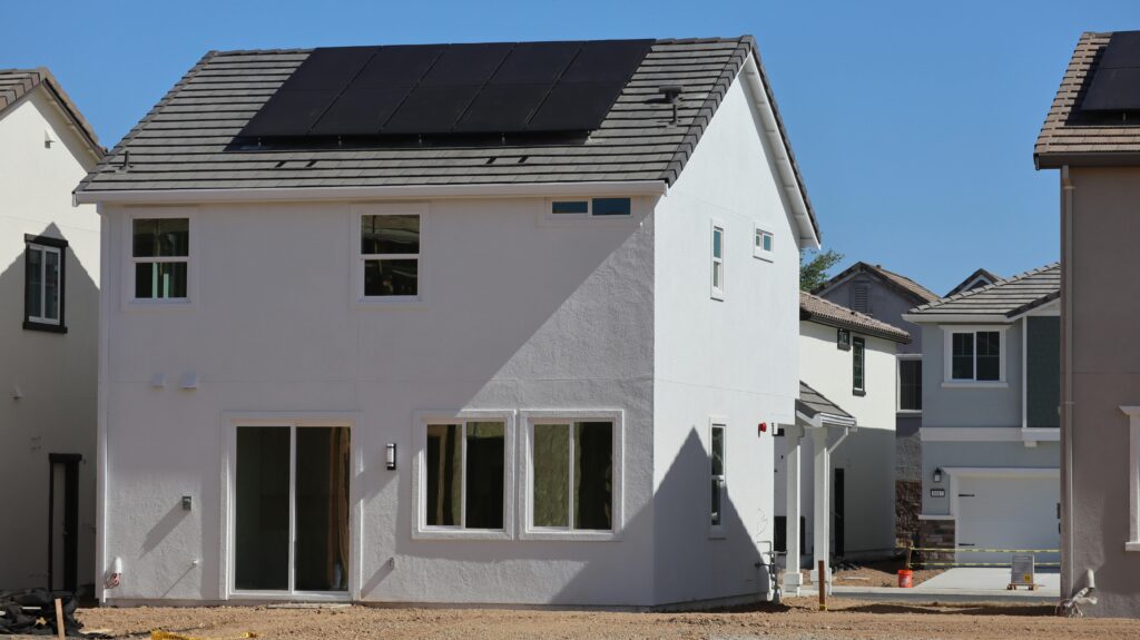 Newly constructed eco-friendly home in Elk Grove, CA, featuring rooftop solar panels for sustainable energy.