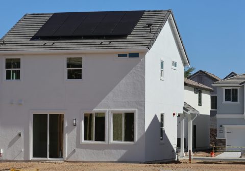 Newly constructed eco-friendly home in Elk Grove, CA, featuring rooftop solar panels for sustainable energy.